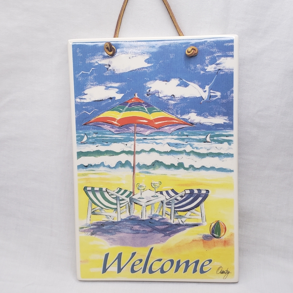 Ceramic Welcome Sign Beach Umbrellas And Chairs By The Ocean Anne Ormsby